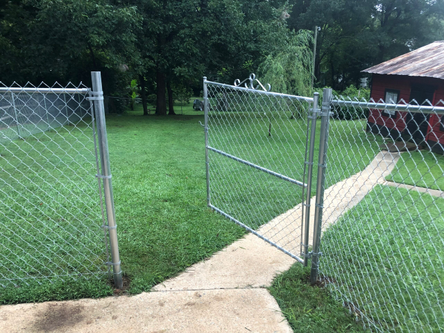 Chain link fence beside field