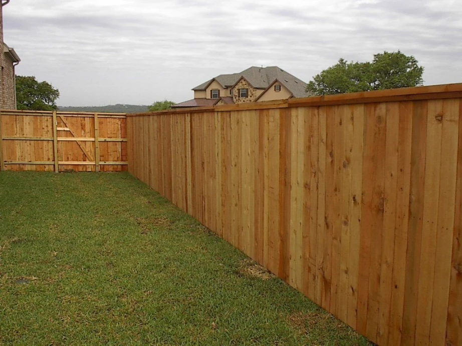Wooden privacy fence installation